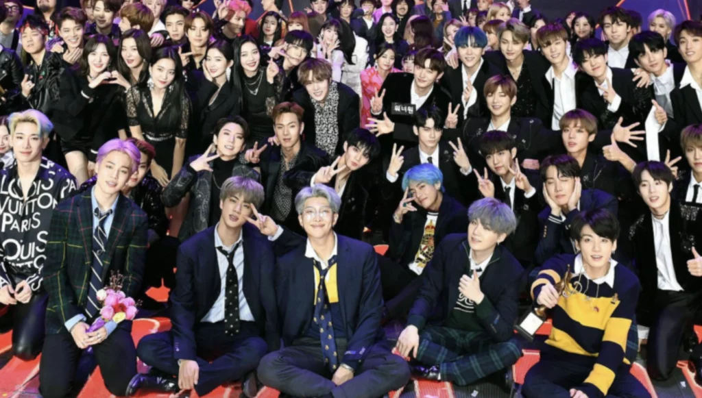 K-pop Group Members Showcasing Diverse Talents at a Prestigious Music Awards Ceremony