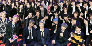 K-pop Group Members Showcasing Diverse Talents at a Prestigious Music Awards Ceremony