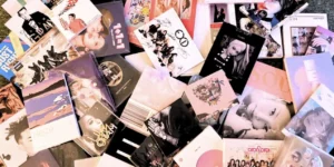 K-pop physical albums collection showcasing various artist releases, photocards, and special editions that have revolutionized physical media sales in the digital streaming era