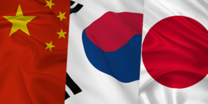 Image of Chinese, Korean, and Japanese flags symbolizing the influence of Japanese and Chinese music industries on K-pop