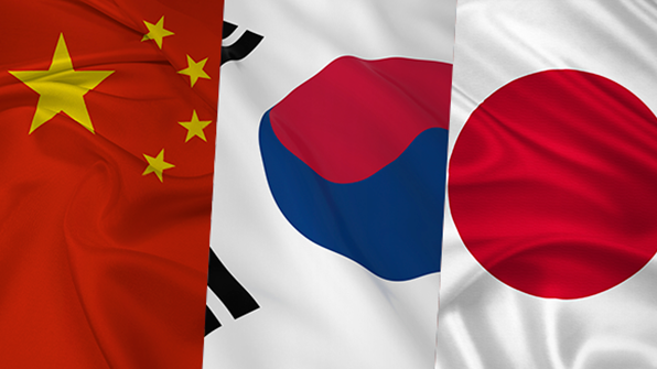 Image of Chinese, Korean, and Japanese flags symbolizing the influence of Japanese and Chinese music industries on K-pop