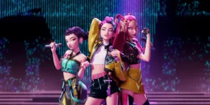 K-Pop Demon Hunters OST Huntrix virtual girl group performing on stage with colorful neon lighting and microphones