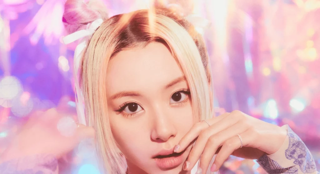 Chaeyoung first album release promotional image featuring blonde hair and dreamy purple pink lighting effects