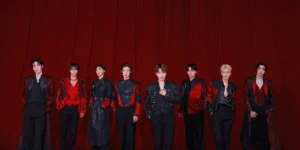 ATEEZ 2025 World Tour In Your Fantasy official poster featuring all eight members in dramatic red and black stage outfits standing against burgundy curtain backdrop at Incheon Inspire Arena for July 5-6 2025 concerts
