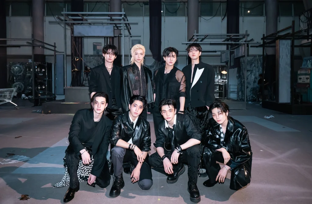 Stray Kids eight members posing in black outfits for DO IT album debut promotional photoshoot showcasing their bold and confident concept for the SKZ IT TAPE series